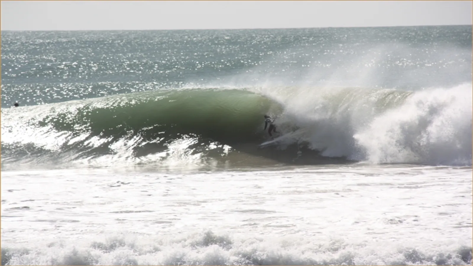 Surfer riding an Atlantic wave at Taghazout Morocco